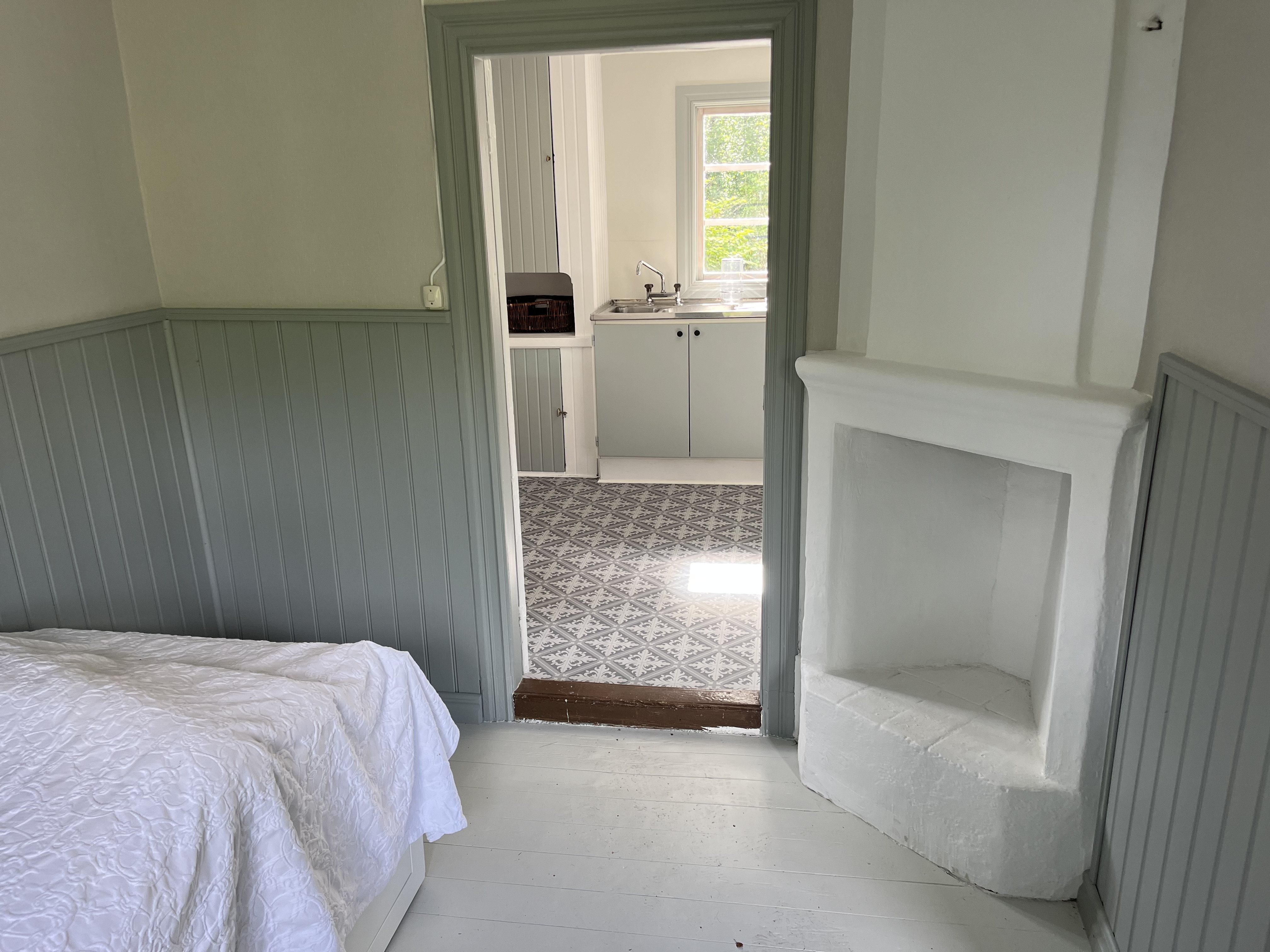 Master bedroom with spacious bed and en-suite bathroom